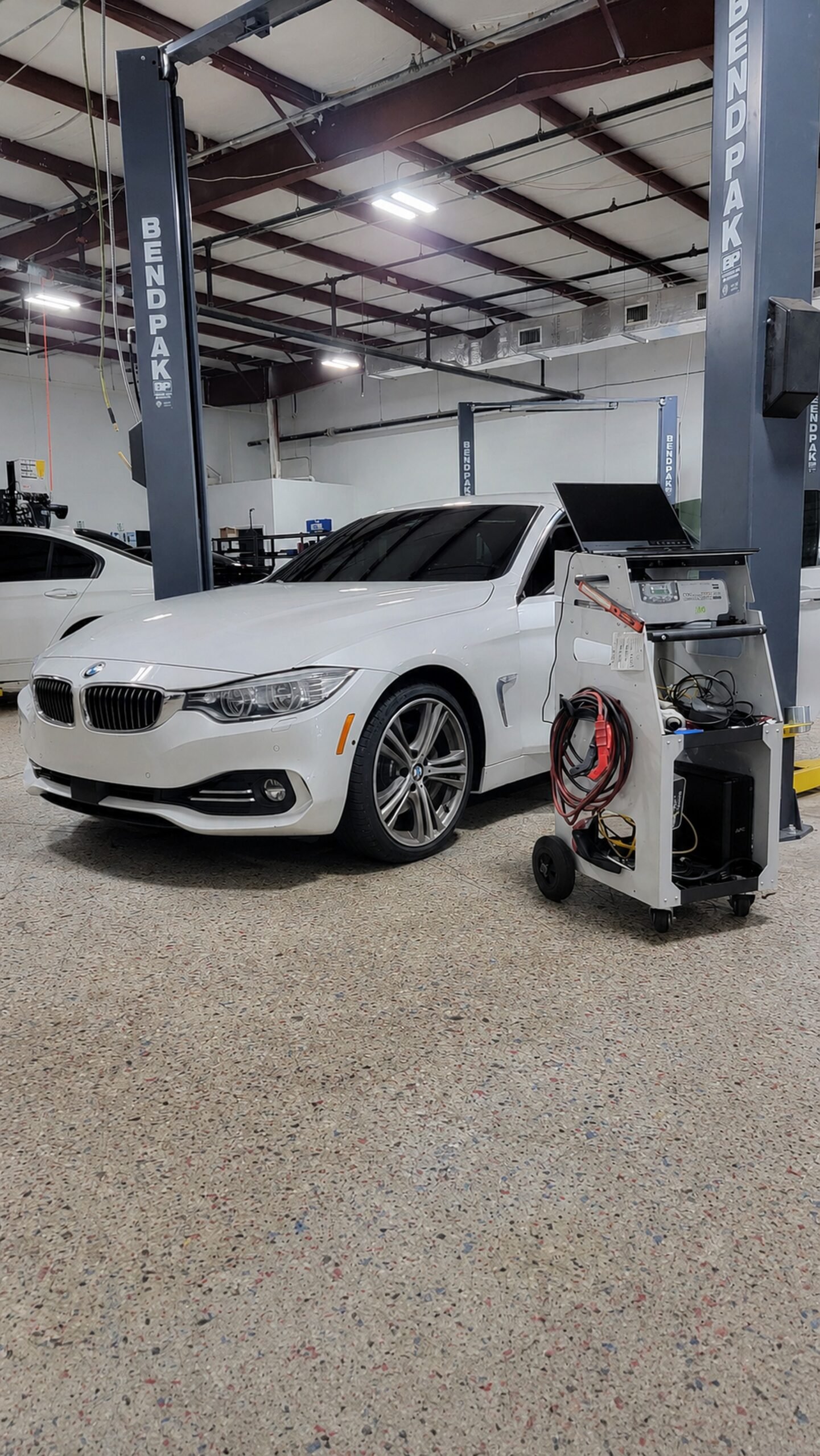 BMW 4 Series in a service bay at Eurocraft Automotive in Orlando