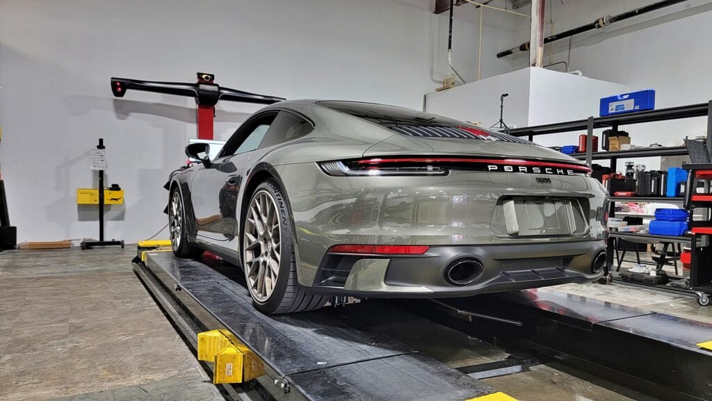 Porsche on the wheel alignment rack at Eurocraft Automotive